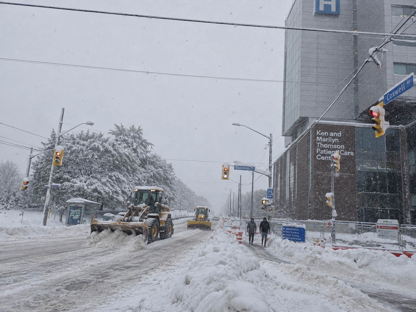 Snow-clearing vehicle on a winter neighbourhood street
